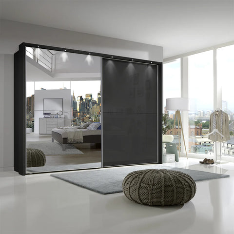 Wiemann Bristol Graphite Sliding Door Wardrobe With Mirror, We will Deliver and assemble the wardrobe. Available in 4 Width Sizes 150cm, 200cm, 250cm and 300cm height is 217cm - Lifestyle Image Background 