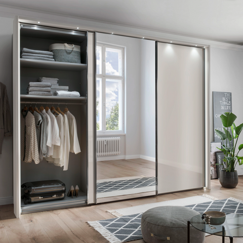 Wiemann Monroe Champagne Glass Sliding Triple Wardrobe with Mirror, Available in 4 width Sizes 225, 250, 280 and 300cm. Also 2 Height Sizes 217cm and 236cm. Premium Quality Wardrobe comes with 2 Years Warranty Depth is 67cm. We will deliver and Assemble for FREE - Wardrobe Including Passepartout Frame With Lights 