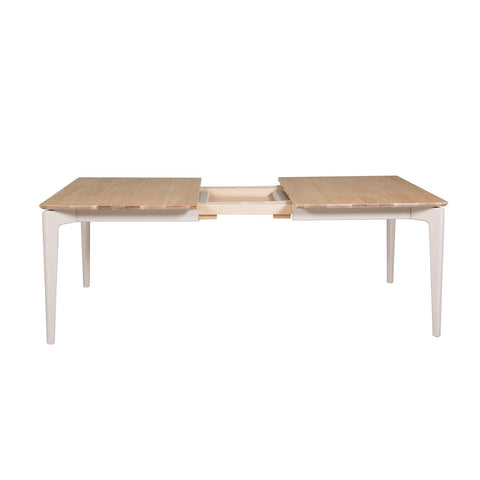 Modern Serenity Extending Dining Table in Cashmere Paint with American White Oak finish, available at Pendle Village Furniture. - 002