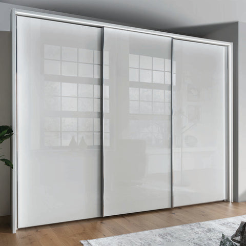 Monroe Triple Wardrobe showcasing elegant sliding doors, chrome handles, and a choice of Bianco Oak, White, Pebble Grey, or Champagne finishes. Interior includes shelves and hanging rails. Experience premium quality with free delivery, professional assembly, and pay monthly options, Brand Wiemann. - Main Image