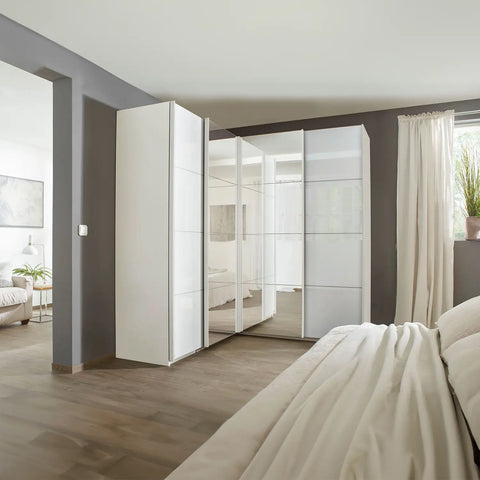 Rauch Lema 4 Door Sliding Corner Wardrobe in White Glass With Mirror - Wardrobe in Lifestyle Image 