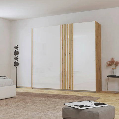 Rauch Mosbach White Glass Sliding Door Wardrobe, Carcase Artisan Oak, Front White Glass with Vertical wooden panels in oak on the door W226 Height 210 Depth 54cm - Lifestyle Image