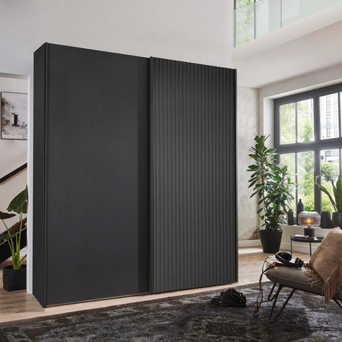 Tulsa 2 Door Black Sliding Door Wardrobe showcased in graphite colour with a slated structure door. Modern design with free delivery and assembly by Wiemann. - Lifestyle Image