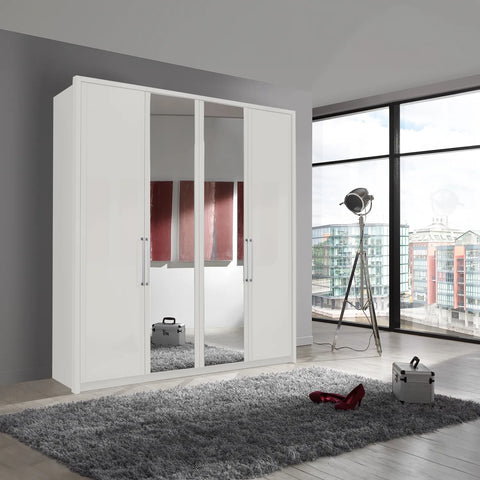 Image of Wiemann Bristol White 4 Door Wardrobe with Mirror. Option of Matt or Glass finish on side doors, with middle doors featuring mirror pads. Dimensions: Width 200cm, Height 216cm, Depth 58cm. Free Delivery and Assembly. 12 months interest-free pay monthly available. - Lifestyle Image