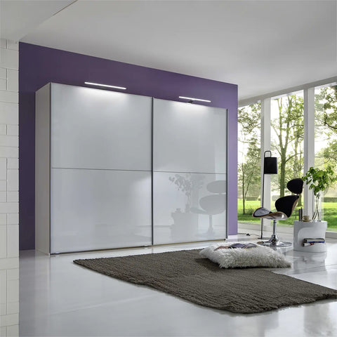 Wiemann Bristol White Sliding Door Wardrobe, We will Deliver and assemble the wardrobe. Available in 4 Width Sizes 150cm, 200cm, 250cm and 300cm height is 217cm - Lifestyle Image with LED Passepartout