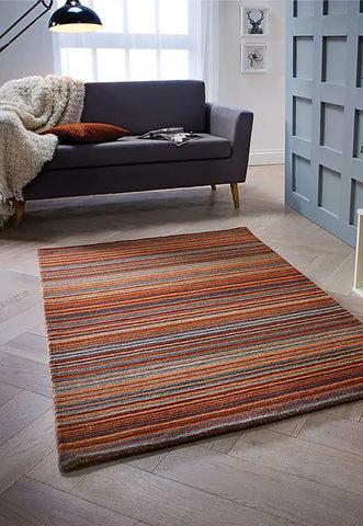 Carter Modern Striped Rug. Available in 8 colours -  Rust/Orange Stripe Rug Lifestyle Image