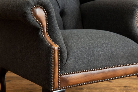 Oswald & Pablo Conrad Dark Grey Herringbone Wool Chesterfield Wing Chair, also available in other fabrics and colours - Stud Detail Image